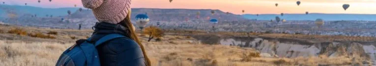 Girl watching hot air balloons, Cappadocia
